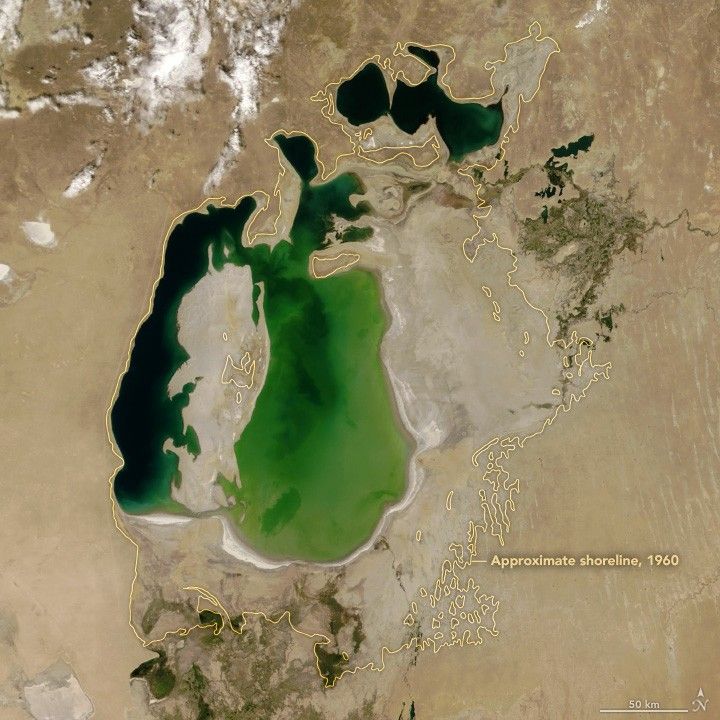 Aral Sea 2000 — NASA MODIS true colour satellite image. Yellow outline shows 1960 shoreline. Lake is severely reduced but still present.