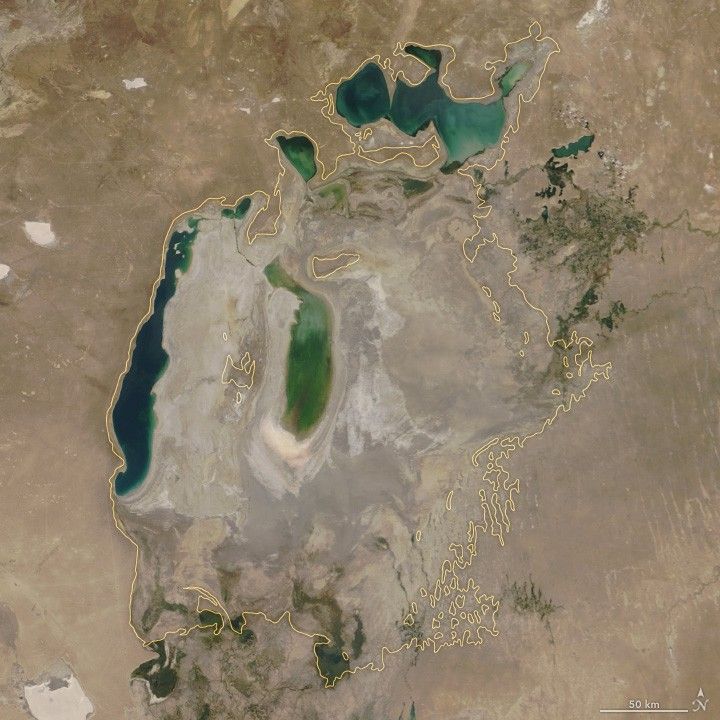 Aral Sea 2018 — NASA MODIS true colour satellite image. Yellow outline shows 1960 shoreline. Inside the outline is now mostly desert.